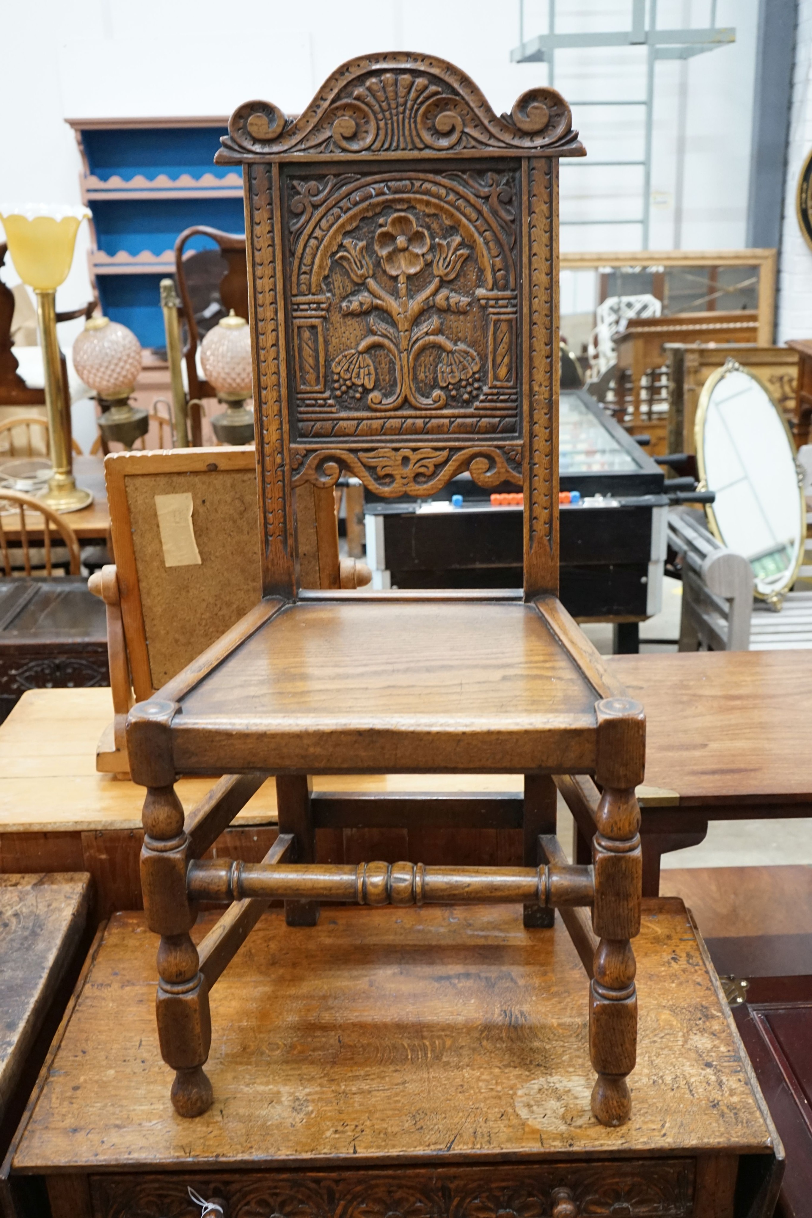 A 17th century style oak drop-leaf side table, width 79cm, depth 45cm, height 74cm together with a carved oak side chair